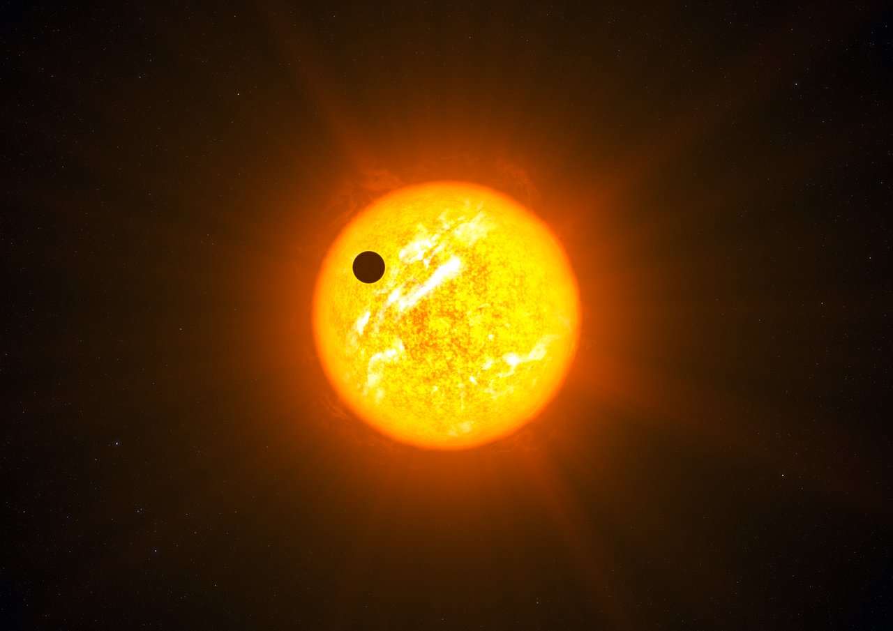 An exoplanet transitting a star. Credit: ESO/L. Calçada.